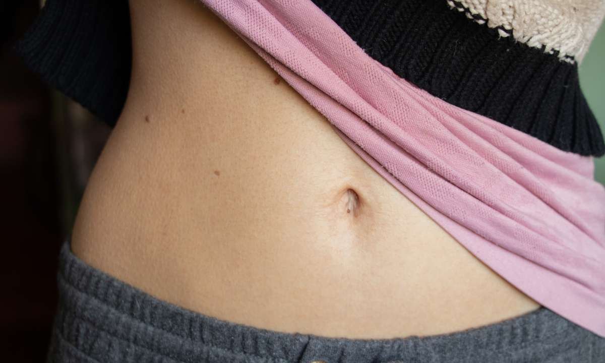 Unraveling Your Strange Dream About Pulling Things Out Of Belly Button